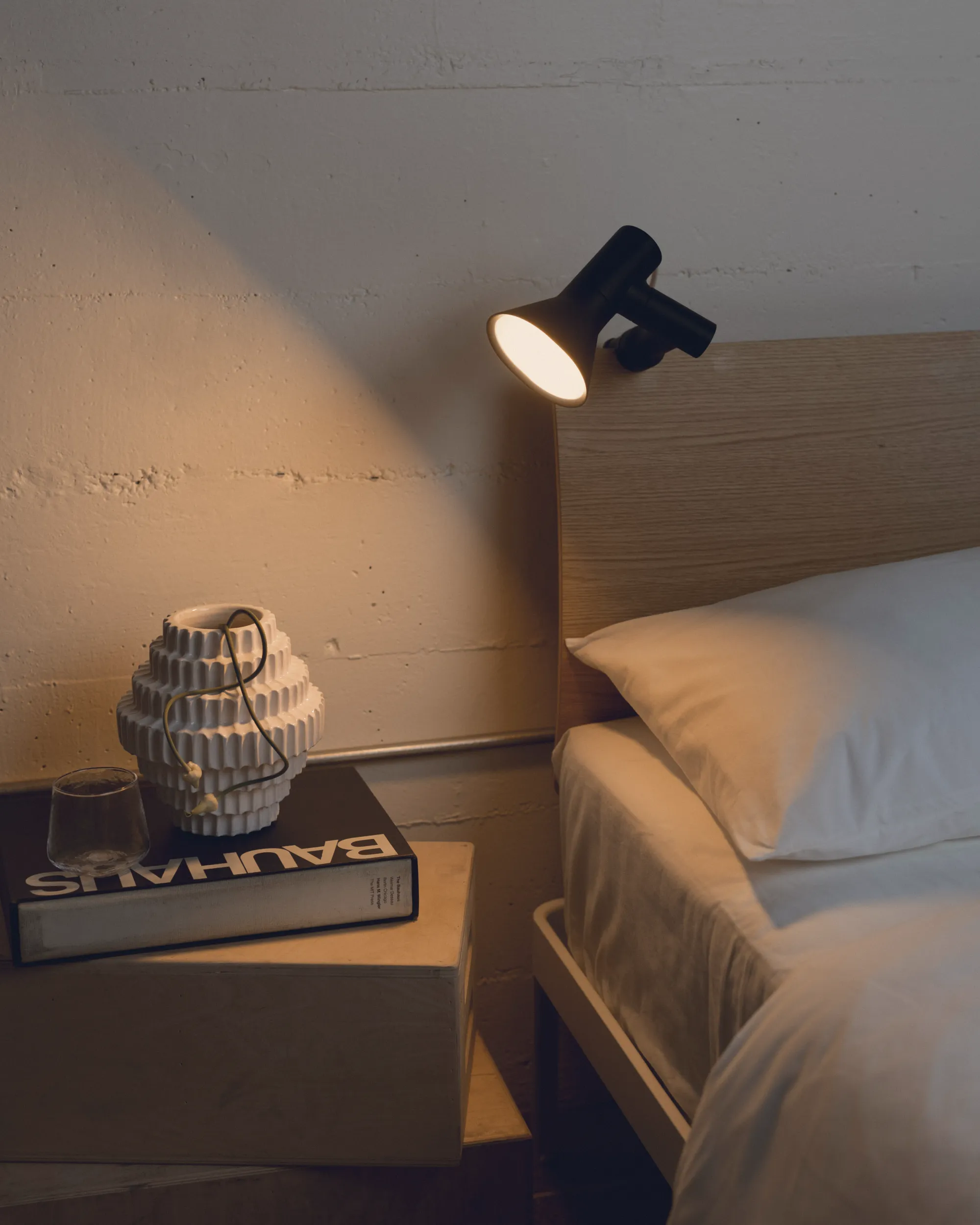 The Gallery Clamp Light by Andrew Ferrier spotlights bedside drawer decor. 