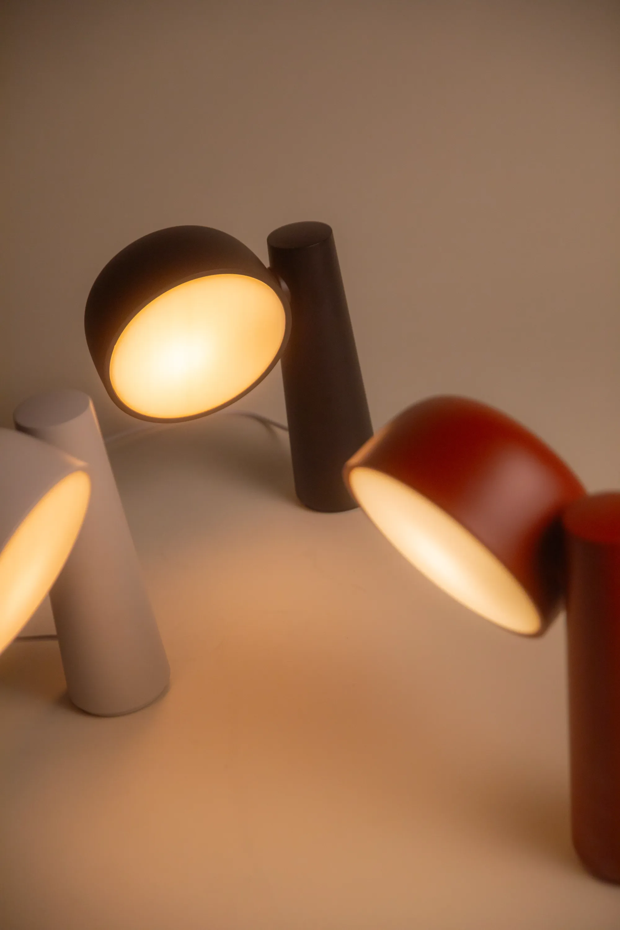 Three of Gantri’s Gio Task Light in different color models are pictured