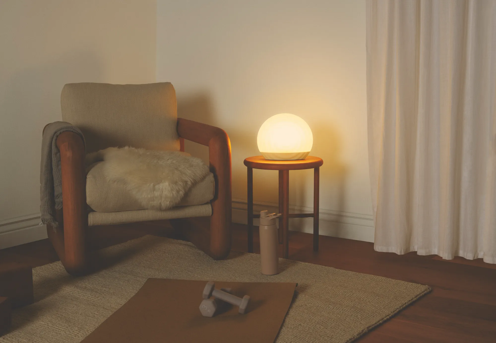 Living room couch being lit up by a Gantri Ripple table lamp