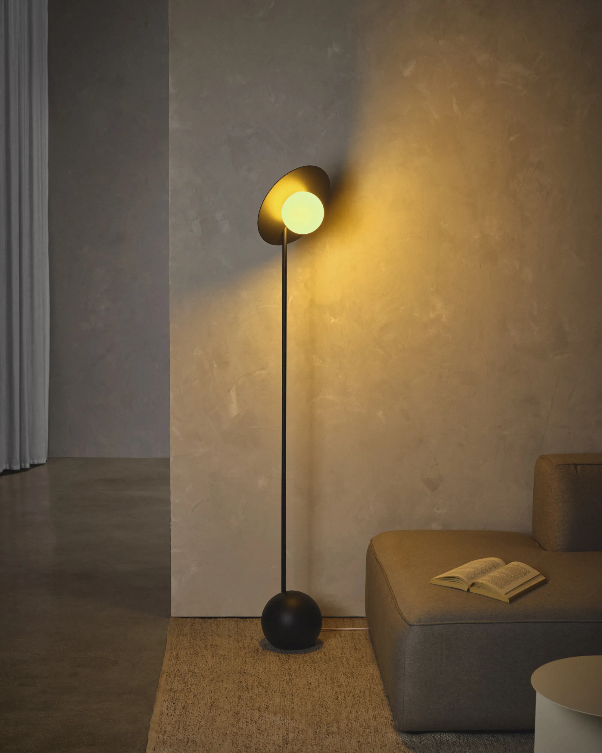 A Gantri Noah Floor Lamp illuminating a living room space