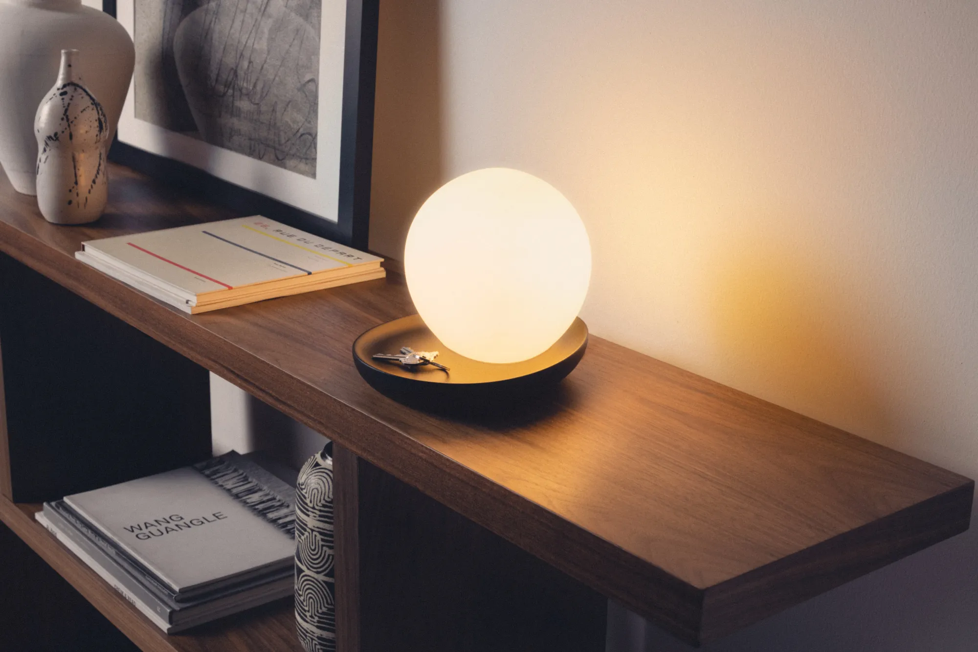 Gantri Baltra Table Lamp illuminating a living room drawer