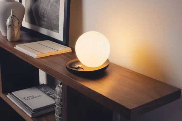 Gantri Baltra Table Lamp illuminating a living room drawer